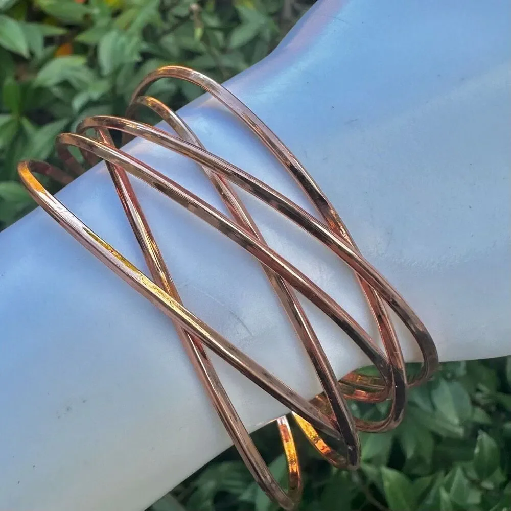 Rose gold tone twisted open cuff bracelet